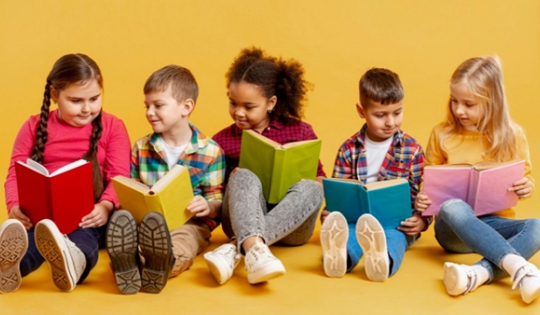 Children sitting and reading together
